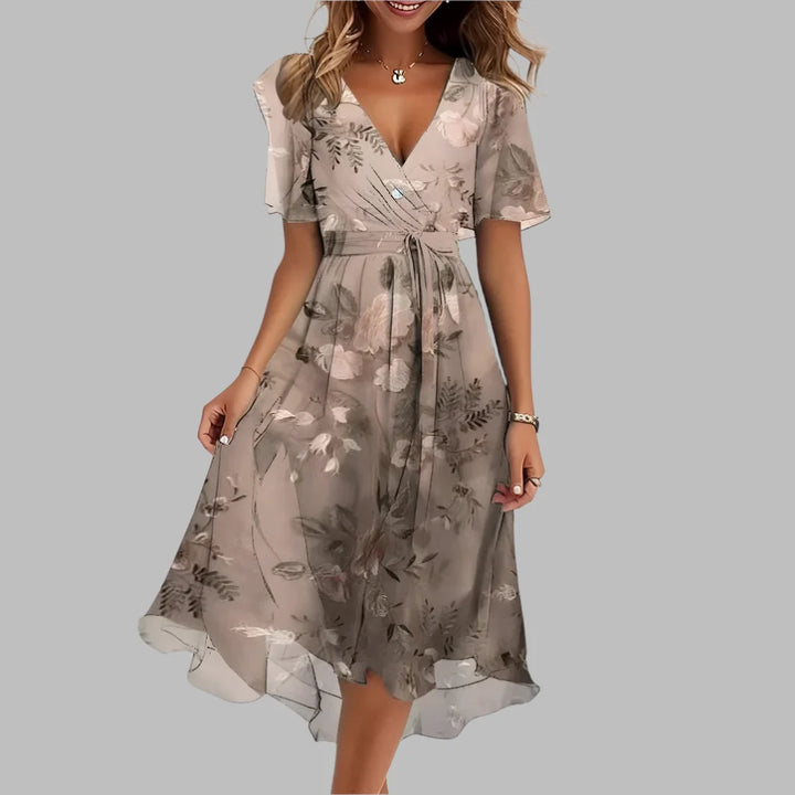 Beautiful women's floral ruched midi dress, a stunning spring/summer occasion dress with short sleeves.