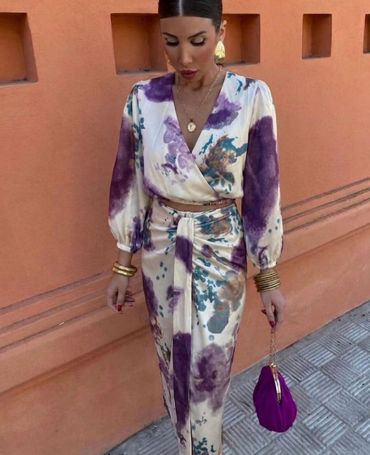 Feminine women's floral blouse and matching midi skirt set. Elegant two-piece summer outfit, perfect for chic style.