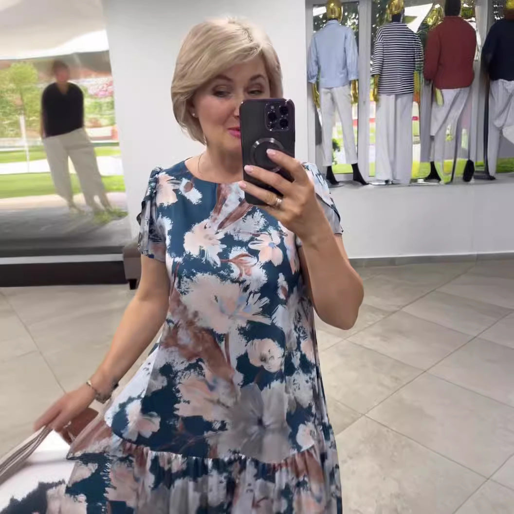 Flowy floral tiered maxi dress for women. Chic summer fashion, ideal for casual or elegant events.