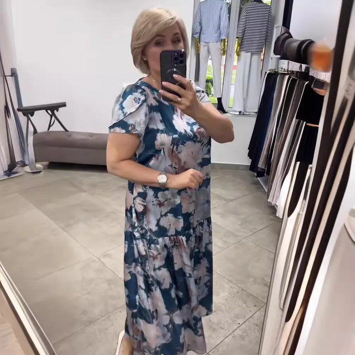 Stylish blue floral tiered maxi dress for women. Elegant summer fashion, great for events & vacations.