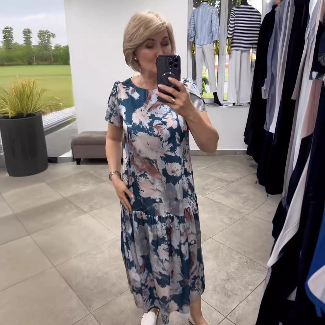 Women's elegant floral tiered maxi dress. Effortless summer style, perfect for vacation or special events.