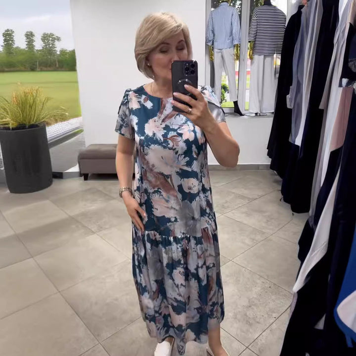 Women's elegant floral tiered maxi dress. Effortless summer style, perfect for vacation or special events.