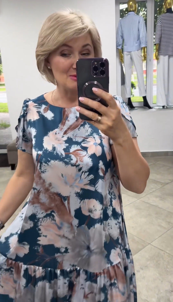 Chic women's summer maxi dress with elegant floral print & tiered skirt. Perfect for warm-weather fashion.