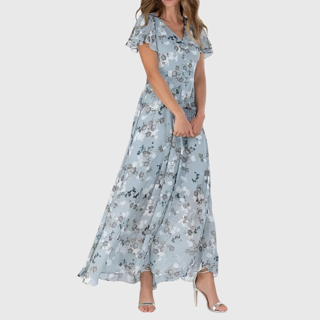 Flowy women's floral maxi dress with V-neck, ideal for versatile summer style; comfortable for casual or party wear.