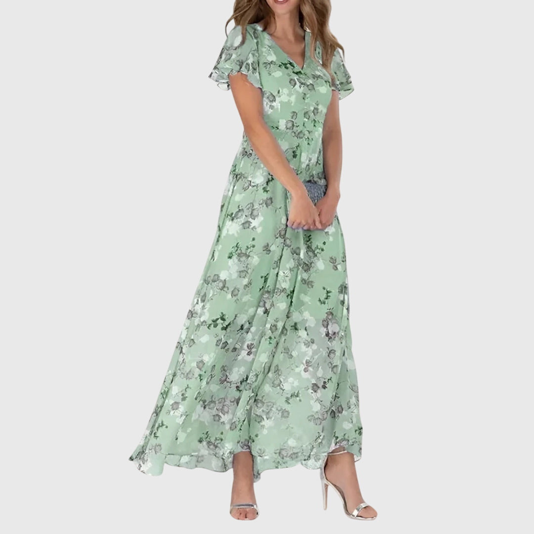 Vibrant floral print maxi dress for women, featuring a flattering V-neck, perfect for elegant spring and summer fashion.