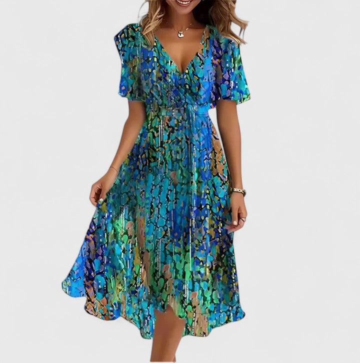 Elegant women's floral V-neck midi dress, perfect for summer. Flowy fabric and vibrant print.