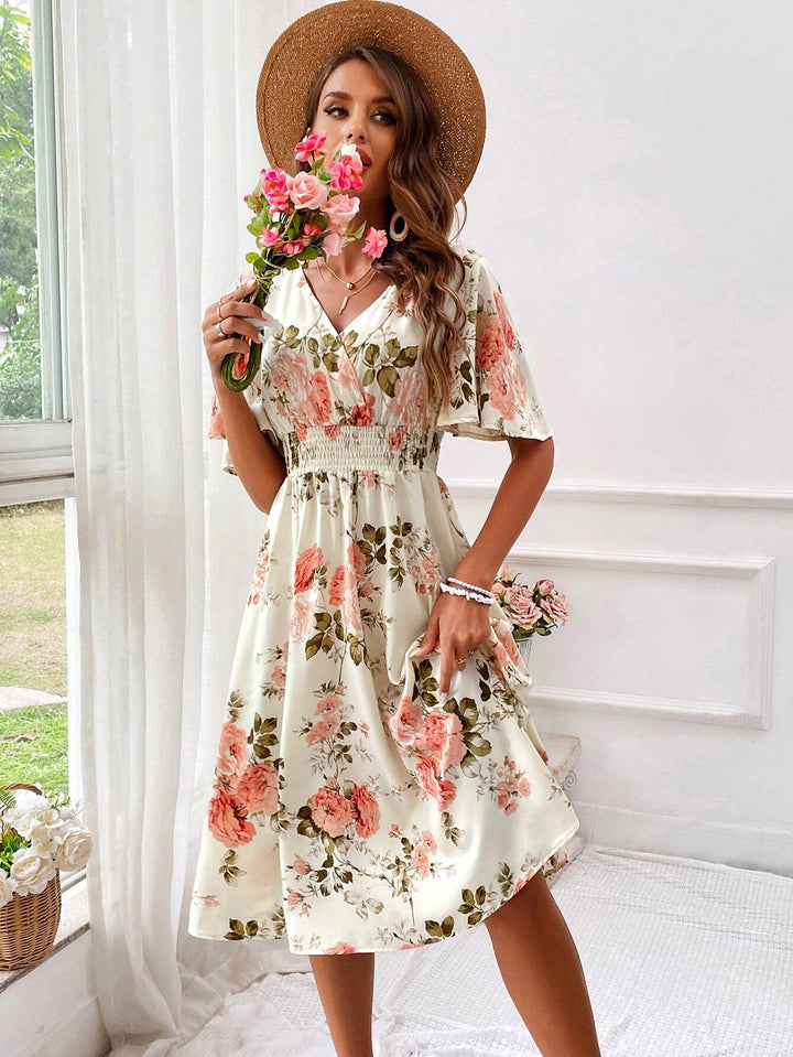 Women's V-neck floral midi dress, an elegant and comfortable choice for summer, featuring a flowy design.