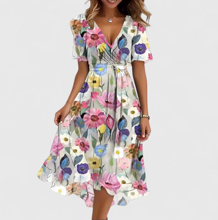 Beautiful flowy floral V-neck midi dress for women, featuring a vibrant print, ideal for elegant summer style.