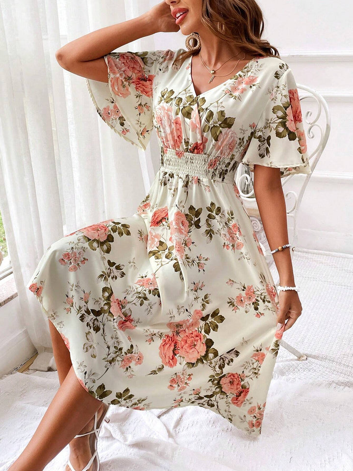 Effortlessly stylish women's floral V-neck midi dress, perfect for spring/summer elegance and comfort.