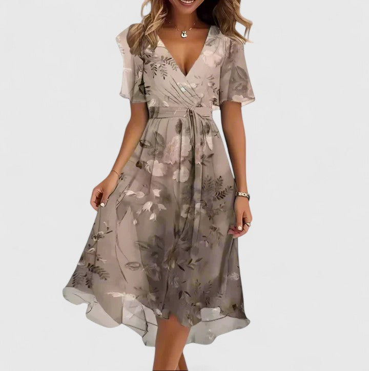 Chic women's floral V-neck midi dress, perfect for elegant summer parties, offering a beautiful flowy silhouette.