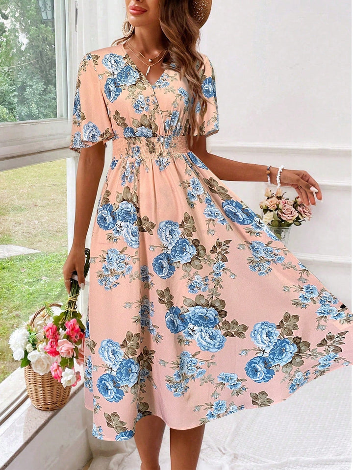 Comfortable women's floral V-neck midi dress, a flowy and elegant choice for spring and summer days.