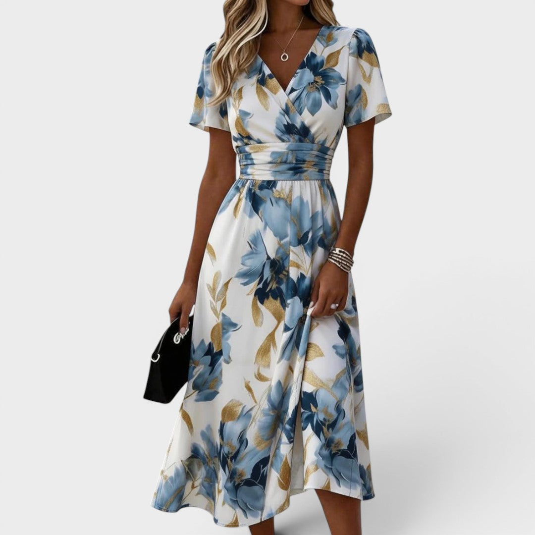Elegant women's floral wrap midi dress, perfect for summer occasions. Feminine style with charming flower print.