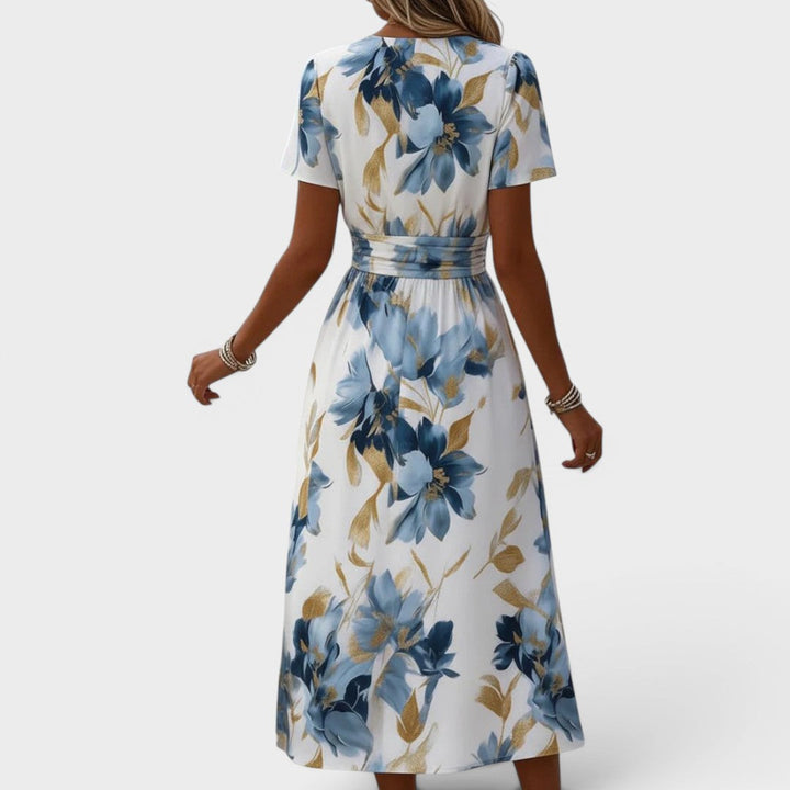 Stylish women's floral wrap midi dress, styled for a summer party. Elegant day dress for various occasions.