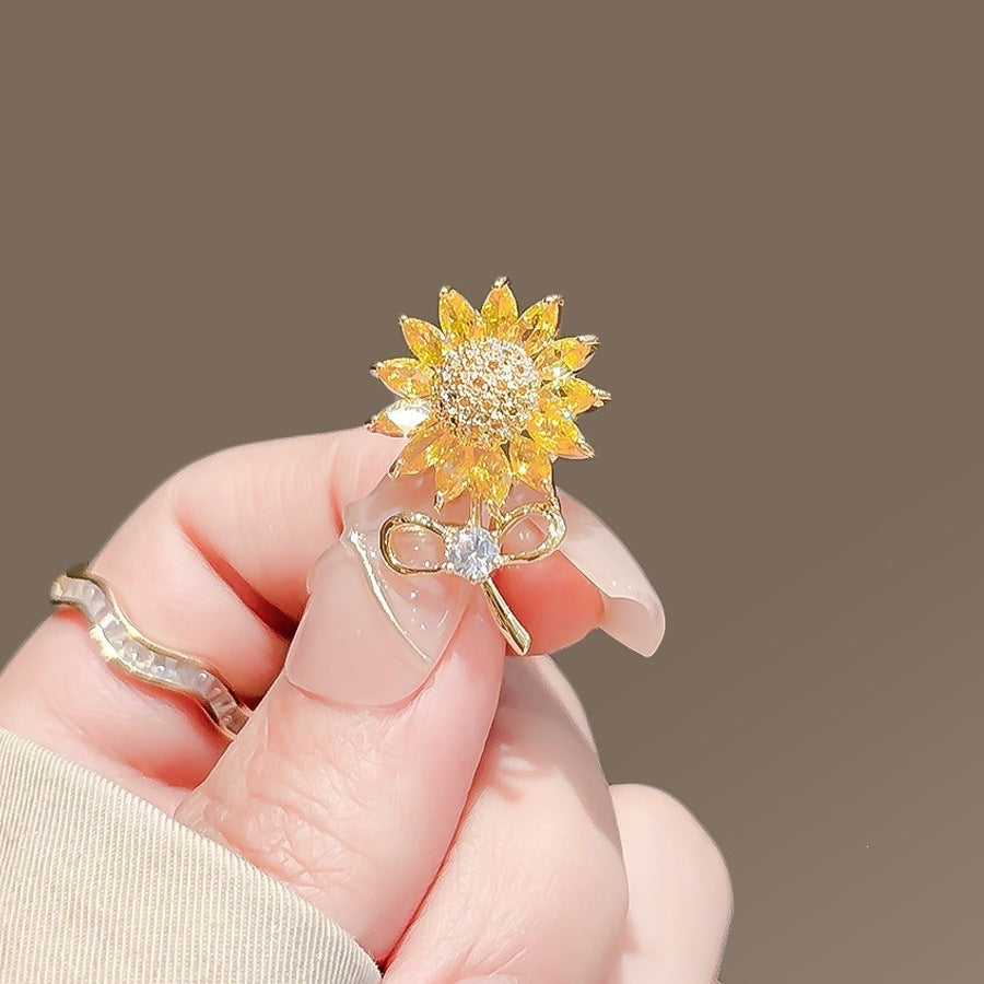 Elegant women's flower brooch pin. Sparkling floral lapel accessory, perfect fashion jewelry for her.