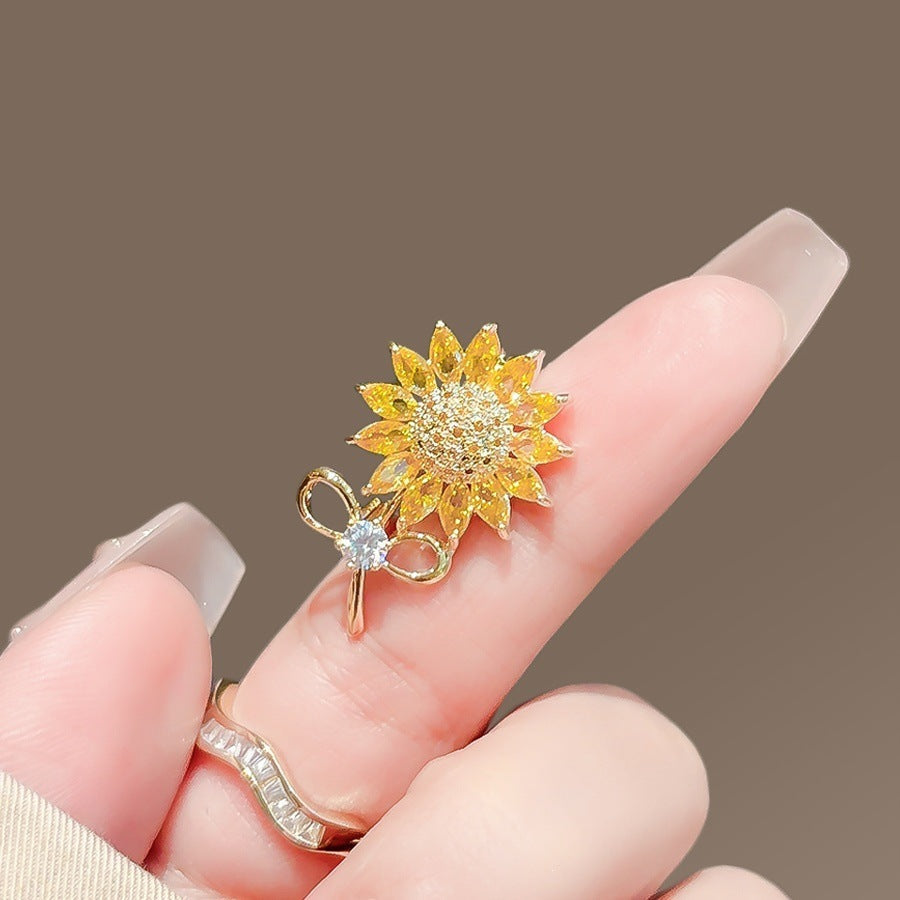 Sparkling flower brooch pin for women. Elegant floral lapel accessory, fashion jewelry, a beautiful gift.