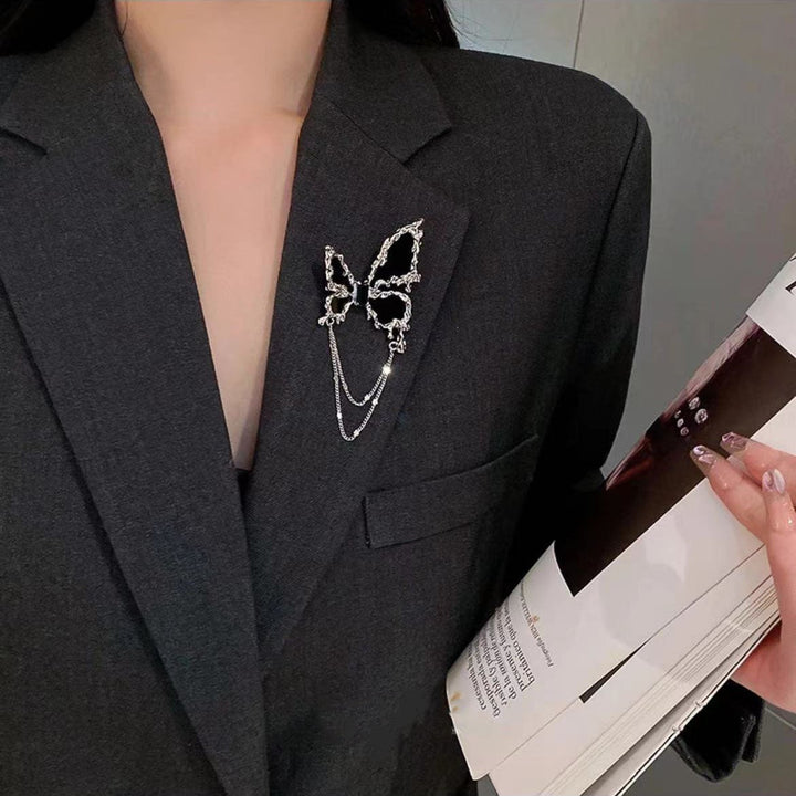 Sophisticated flower brooch with stylish chain, a decorative women's lapel pin for elegant attire.