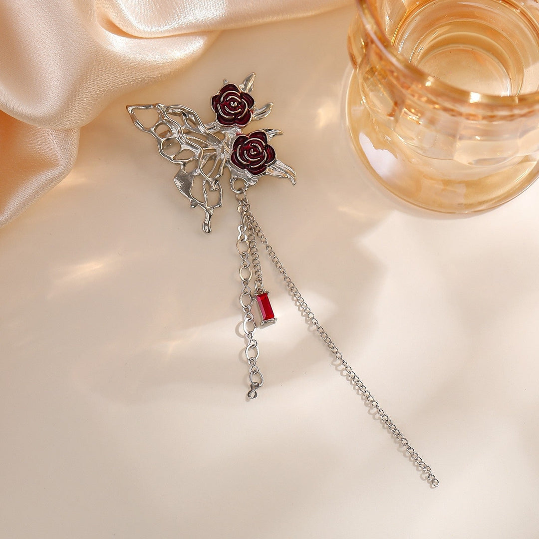 Detailed elegant flower brooch pin with intricate chain design, a charming women's fashion jewelry.