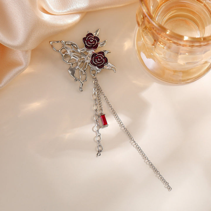 Detailed elegant flower brooch pin with intricate chain design, a charming women's fashion jewelry.