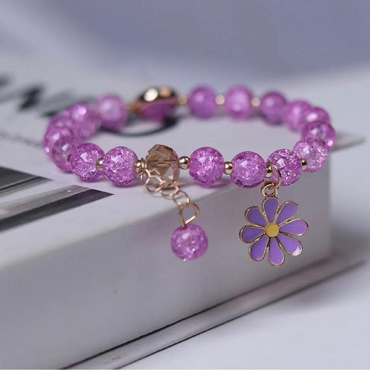 Graceful women's flower charm bracelet, sparkling and elegant for a feminine touch.