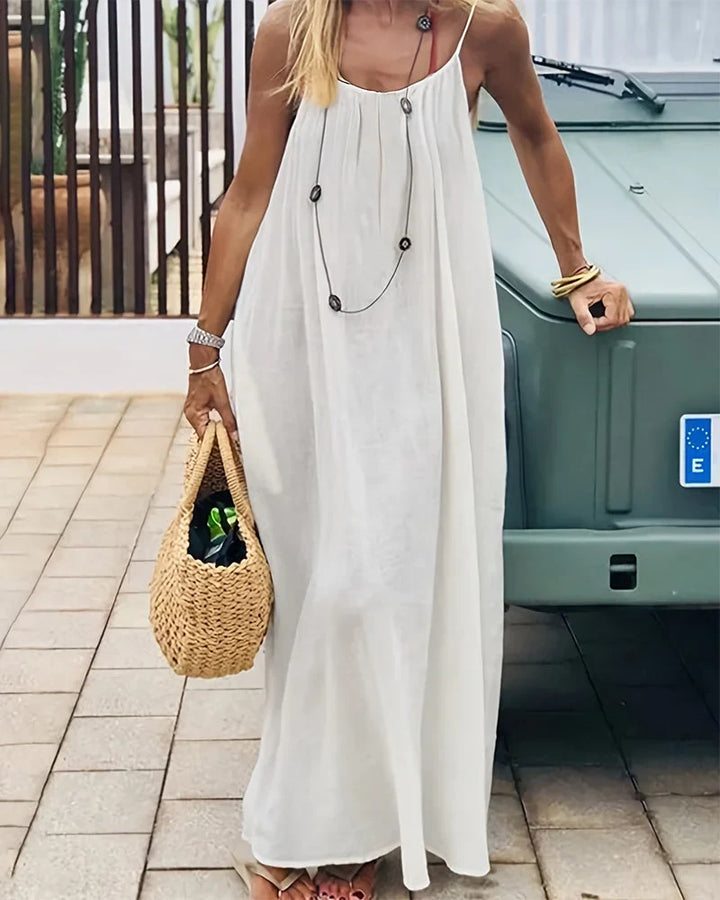Elegant women's flowing cami maxi dress, perfect for summer evenings & vacation style.