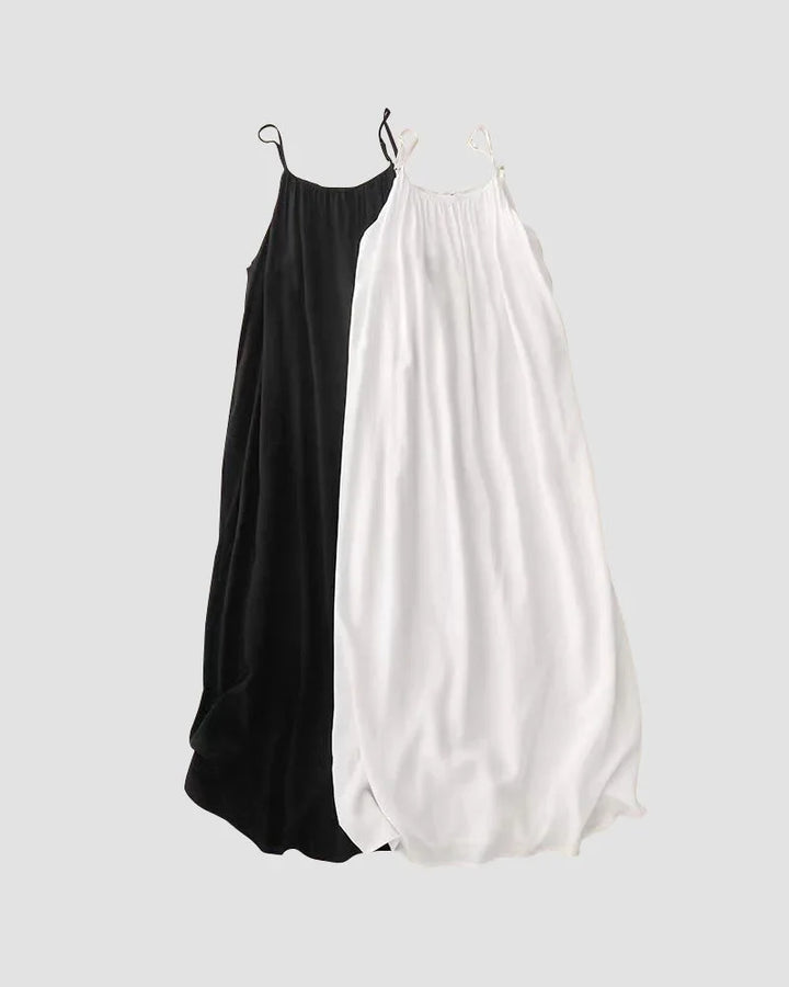 Back view of a flowing cami maxi dress for women, sleeveless, showcasing elegant summer vacation style.