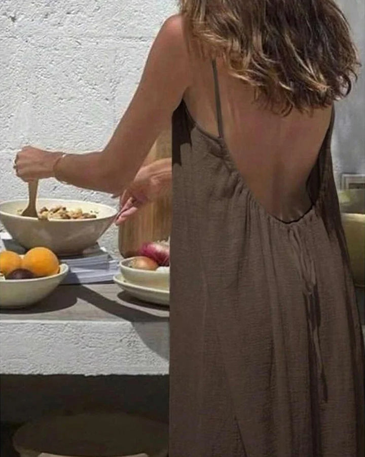 Close-up of the elegant detail on a women's flowing cami maxi dress, perfect for summer & resort wear.