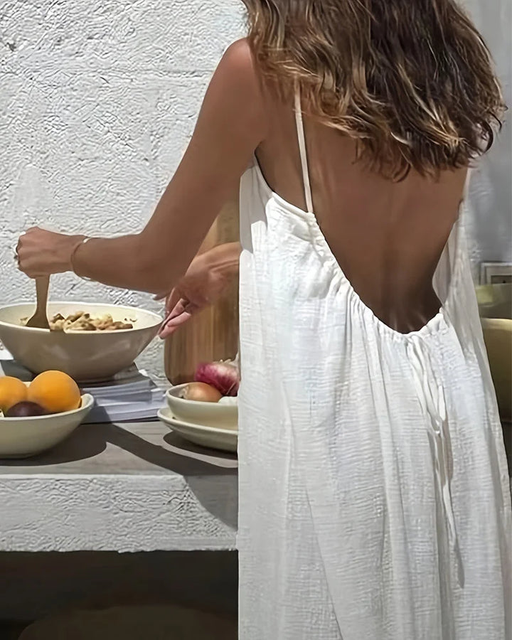 Casual elegant women's cami maxi dress, flowing sleeveless style, great for summer days & beach resort.