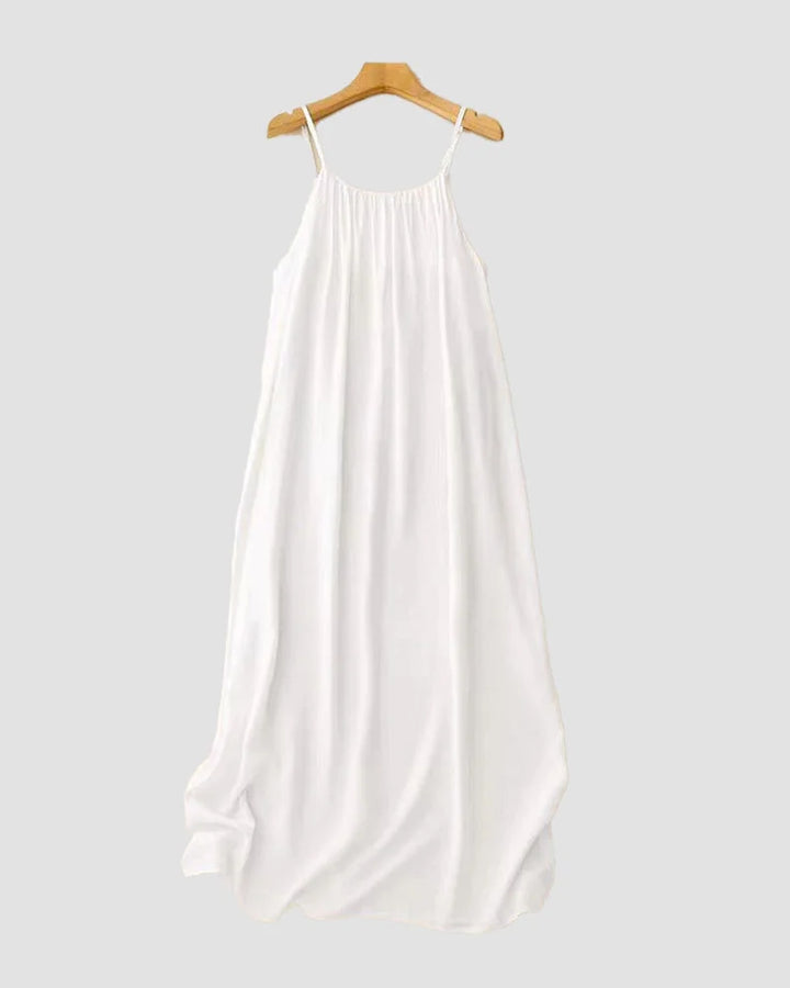 Vibrant women's flowing cami maxi dress, sleeveless, ideal for beach, vacation, and chic summer fashion.