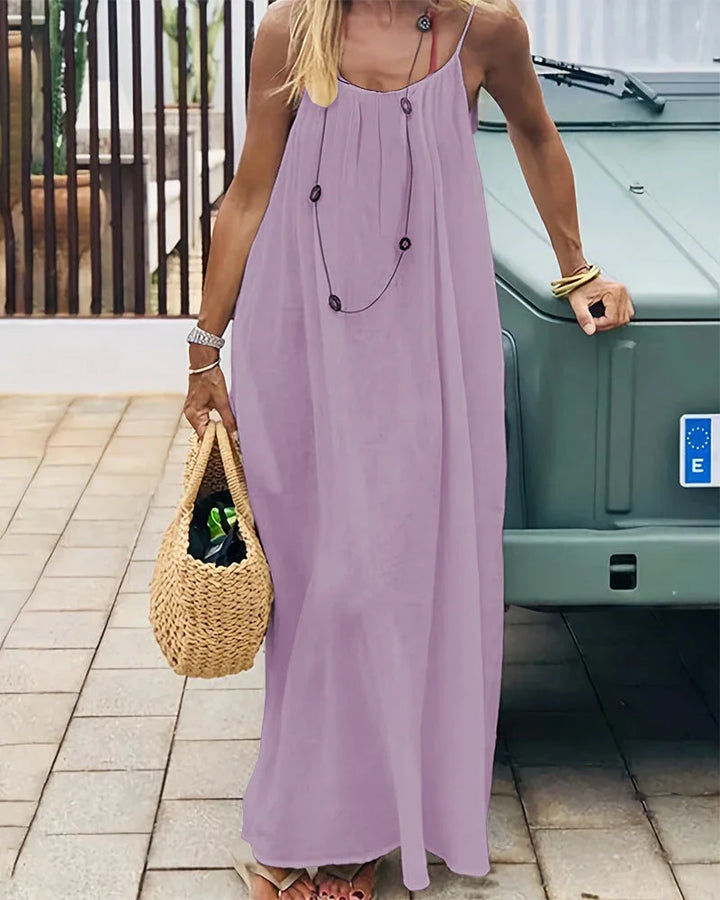Versatile women's flowing cami maxi dress, sleeveless, ideal for beach, casual outings, or elegant events.