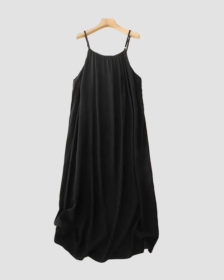 Front view of an elegant women's flowing cami maxi dress, sleeveless, ideal for summer fashion & resort.