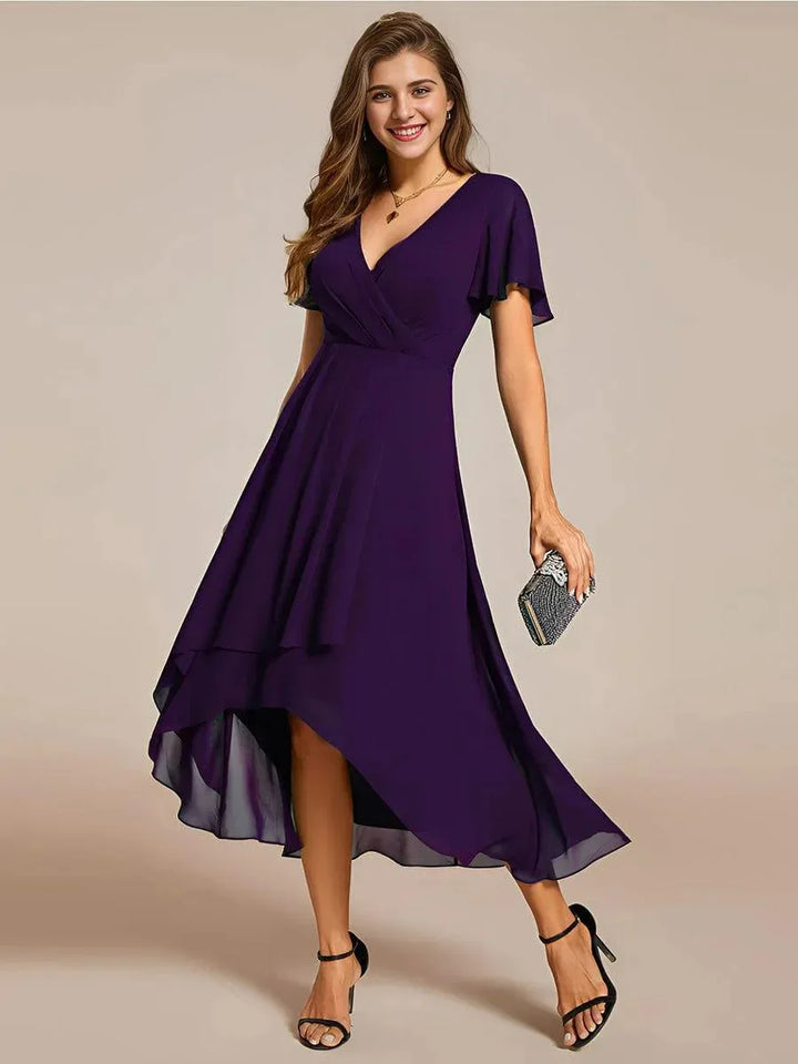 Women's elegant flowing midi dress showcasing high-low hem & flutter sleeves, A-line, V-neck. Versatile styling.