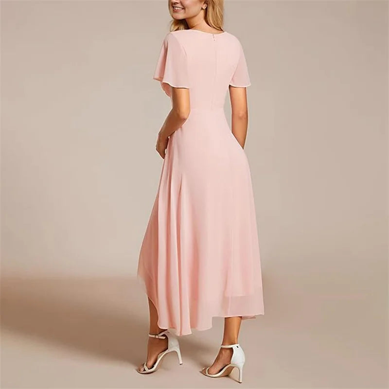 Women's elegant flowing A-line midi dress, V-neck with flutter sleeves. Comfortable, versatile day and evening dress.