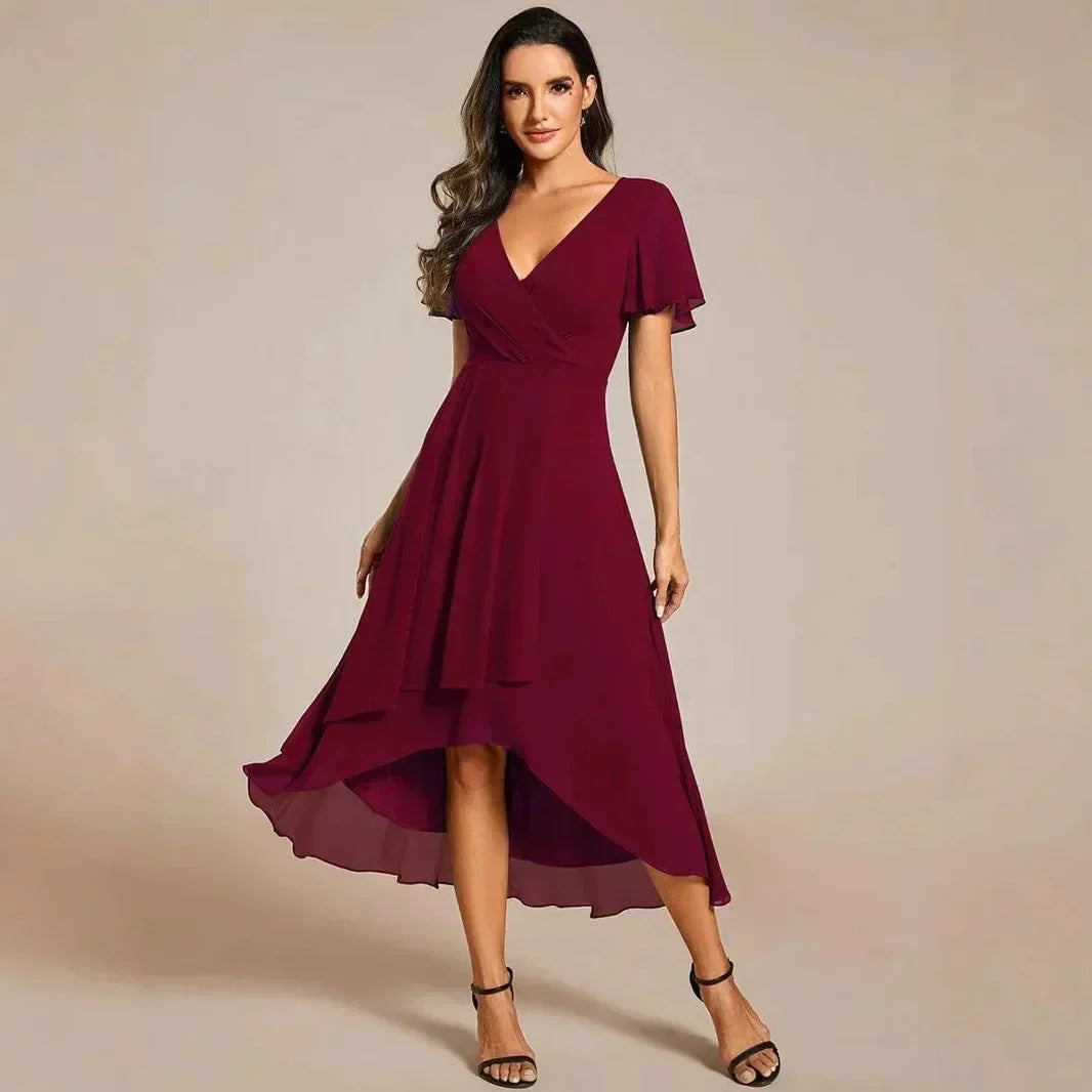 Casual yet chic women's flowing midi dress, A-line, V-neck, flutter sleeves, comfortable for everyday wear.