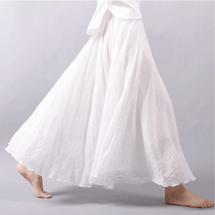 Full-length women's bohemian maxi skirt, capturing its light, airy fabric and summer fashion appeal.