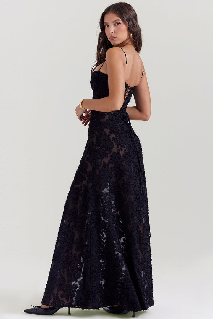 Close-up of elegant bodice on women's flowy maxi dress, highlighting chic details for special occasions.