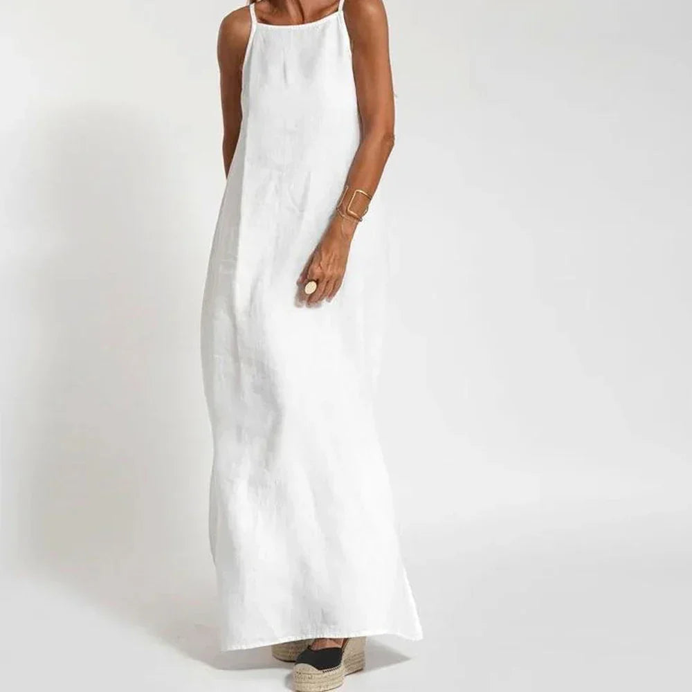 Elegant women's flowy maxi slip dress with stylish side slits, perfect for summer evenings or vacation wear.