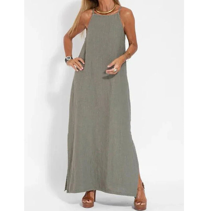 Black women's flowy maxi slip dress with stylish side slits, an elegant choice for evening or events.