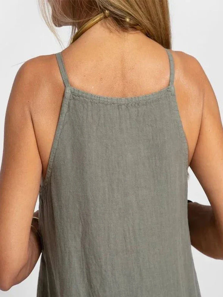 White women's flowy maxi slip dress with stylish side slits, perfect for summer vacation or beach.