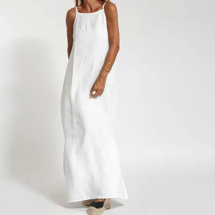 Flowy women's maxi slip dress with elegant side slits, offering a sleek, comfortable, and versatile style.