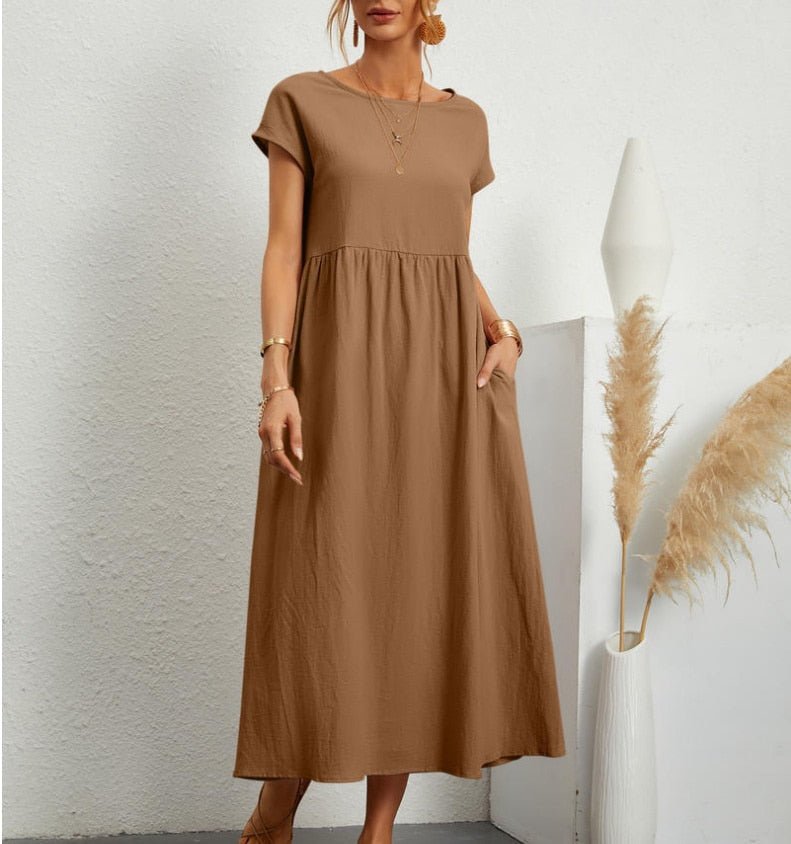 Soft, breathable women's flowy maxi dress. Elegant summer style, comfortable for versatile seasonal wear.
