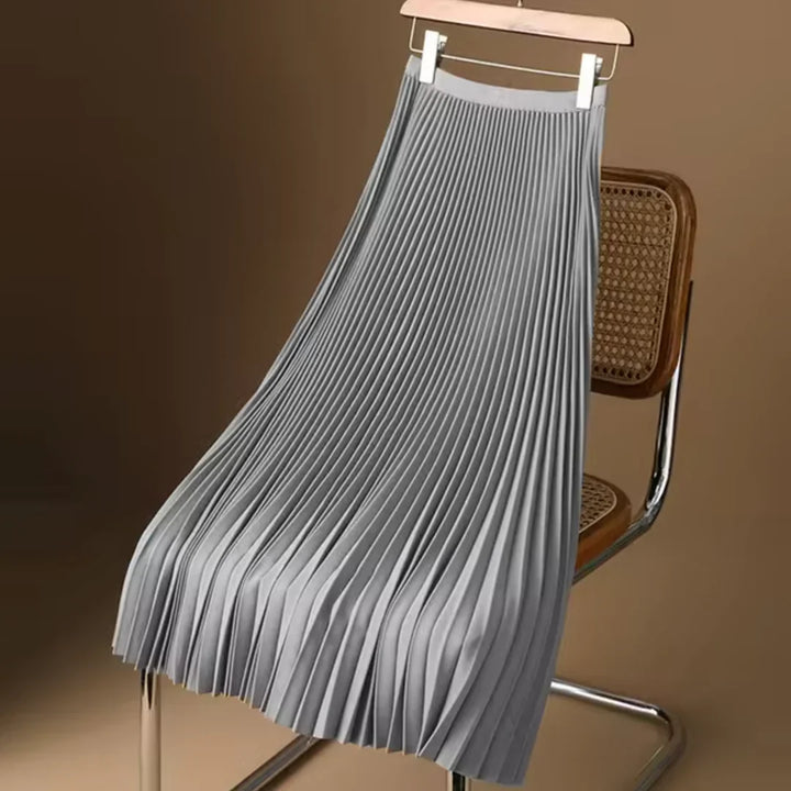 Versatile women's flowy pleated midi skirt. Elegant for work or casual, all-season fashion choice.
