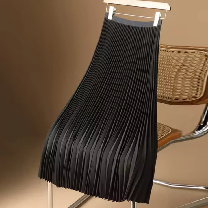 Comfortable women's flowy pleated midi skirt. Elegant, versatile, and stylish for all-season wear.