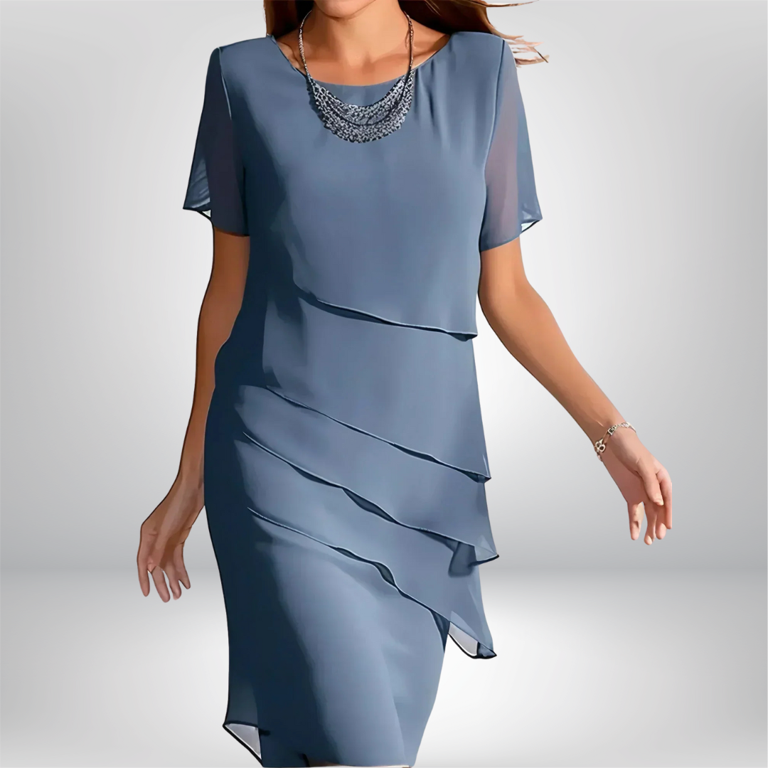 Elegant women's flowy short sleeve dress in a vibrant color, perfect for spring occasions or summer parties.