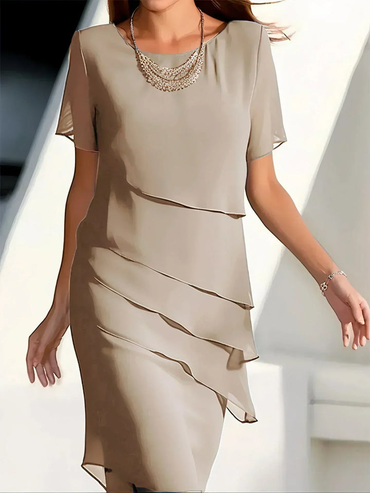 Beautiful elegant women's short sleeve dress with a flattering flowy silhouette, great for any occasion.