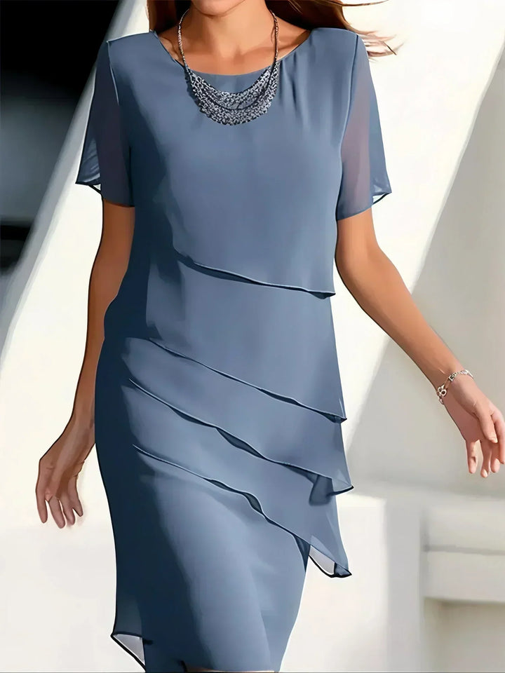 Versatile flowy short sleeve dress for women, offering effortless style and comfort for spring and summer.