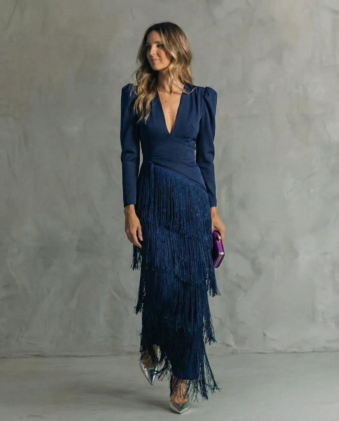 Stylish blue V-neck long sleeve midi dress with flowy fabric and fringe details, ideal for evening parties.