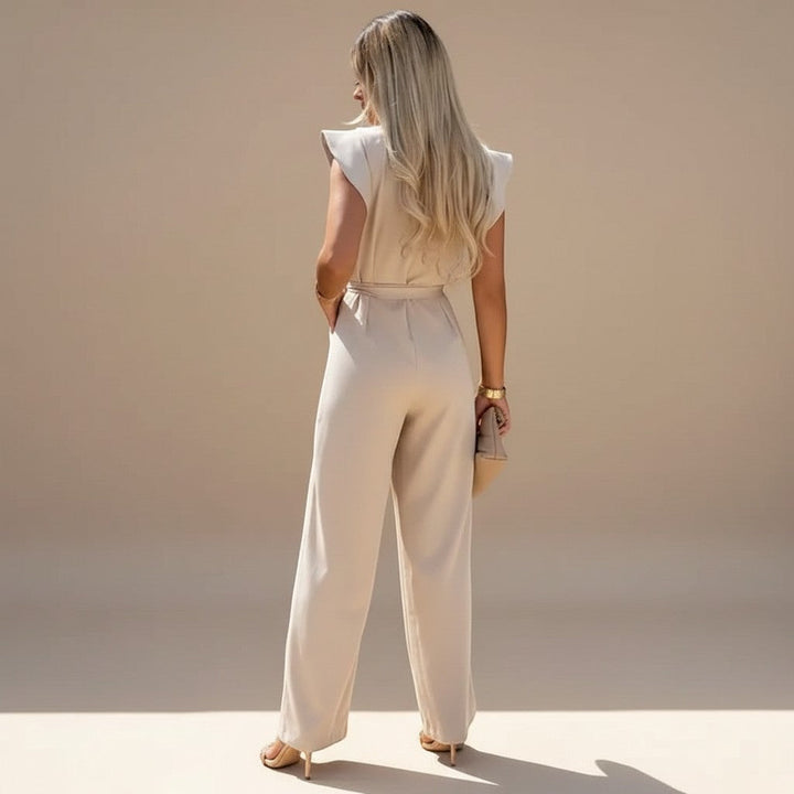 Comfortable women's wide leg jumpsuit featuring elegant flutter sleeves & a stylish waist tie.