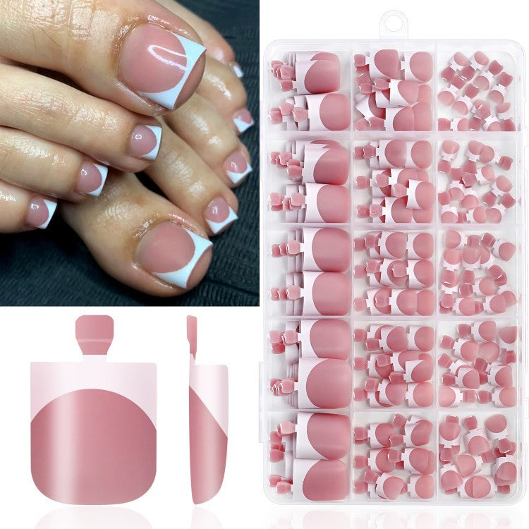 Classic French tip press-on nails for women, nude pink artificial nails, ideal beauty accessory & manicure kit.