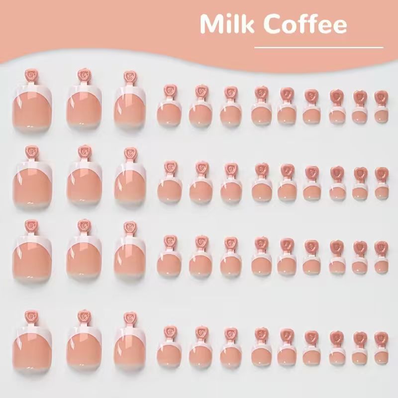 White French tip press-on toenail set. Easy false nails for a quick & elegant women's pedicure.