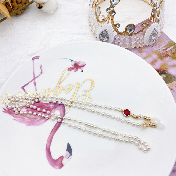 Versatile white pearl necklace for women, featuring exquisite golden accents; a timeless fashion accessory.